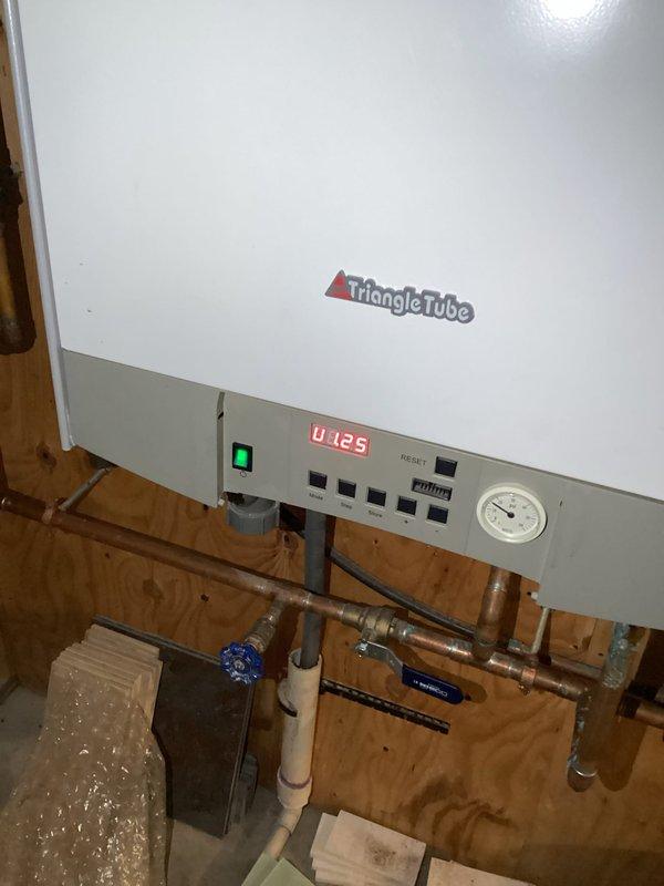 Responded to a no-heat service call for a Triangle Tube boiler system. Upon inspection, determined the Wilo circulation pump had failed, preventing proper circulation to in-floor heating system. Replaced defective pump and verified proper operation of manifold distribution system with all zone valves functioning correctly.