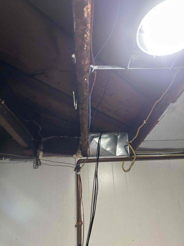 Completed a 200 amp overhead service upgrade, installing new meter enclosure, service mast, and weatherhead at existing outdoor location. Installed new 40-space main electrical panel in basement with all new circuit breakers while maintaining existing circuit protection, along with whole home surge protection and proper grounding via dual 8' ground rods. Also installed 30 amp dedicated wiring with junction box for water heater in unfinished basement ceiling area.