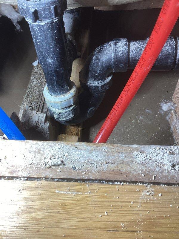 Responded to first floor bathroom toilet leak that was causing water damage to kitchen ceiling below. Diagnostic assessment revealed damaged wax ring at toilet base and broken one-piece tubular drain nut on tub. Completed toilet pull and reset with new wax ring installation and replaced damaged tubular nut on tub drain assembly to resolve both leak sources.