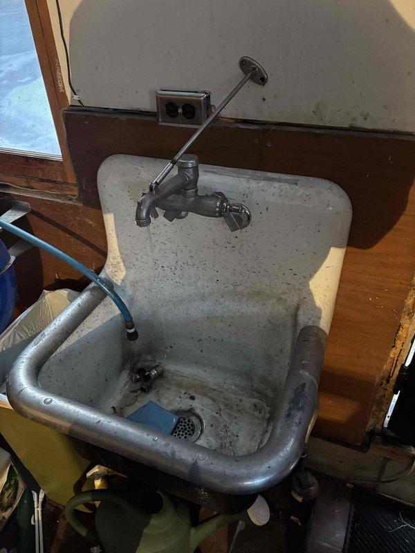 Performed routine plumbing preventative maintenance service including flushing the water heater to remove sediment and conducting leak detection in the utility room. Noted homeowner's concern about potentially frozen underground water lines to the garage service sink, recommended air testing these lines in spring to verify condition and functionality.