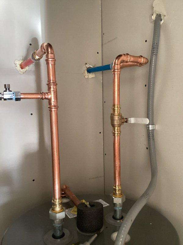 Successfully completed warranty replacement of existing water heater, installing a Rheem 50-gallon electric water heater (warranty valid until 4/1/2026). Re-piped water lines above tank with 18" of hard copper line in/out, connected to existing 240V dedicated electrical line, and tested system for proper operation. All work covered by 1-year workmanship warranty.