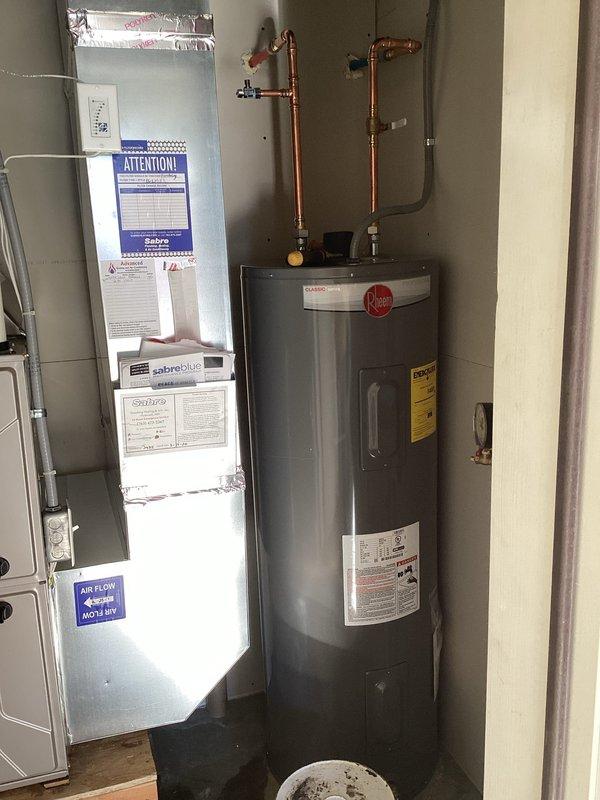 Successfully completed warranty replacement of existing water heater, installing a Rheem 50-gallon electric water heater (warranty valid until 4/1/2026). Re-piped water lines above tank with 18" of hard copper line in/out, connected to existing 240V dedicated electrical line, and tested system for proper operation. All work covered by 1-year workmanship warranty.