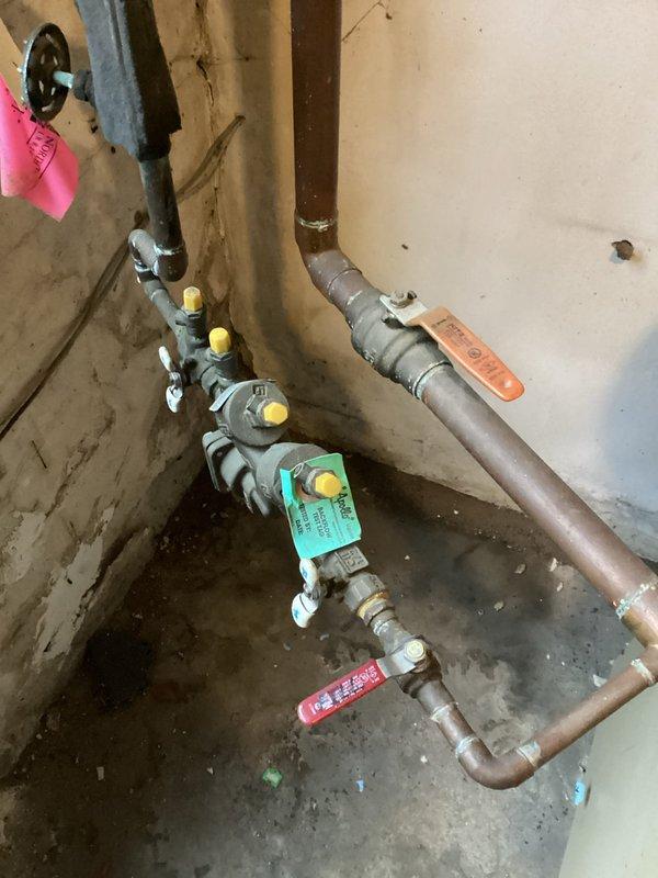Completed RPZ and PVB backflow testing at property. Both devices passed inspection. Verified proper functioning of pressure zones and spring operation during startup sequence. Tagged valves appropriately and documented system condition with photos of exterior installation and interior valve assembly.