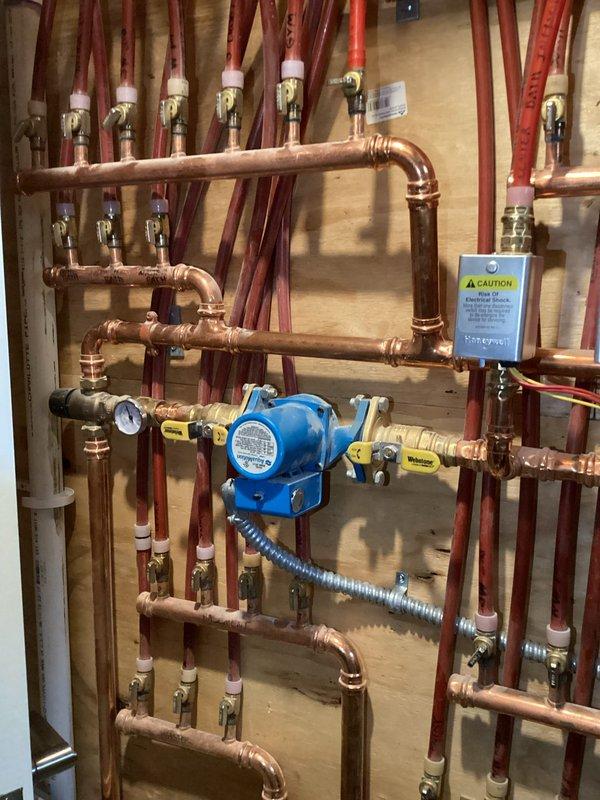 Responded to service call for gas odor at customer's Navien boiler. Investigated and determined source of leak was at the exhaust coupling, not the gas line. Heat exchanger was found to be compromised and was replaced to resolve the gas leak issue. System was tested after repair with no further gas odor detected.