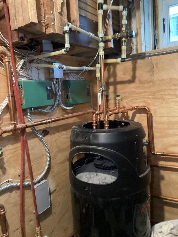 Responded to service call for gas odor at customer's Navien boiler. Investigated and determined source of leak was at the exhaust coupling, not the gas line. Heat exchanger was found to be compromised and was replaced to resolve the gas leak issue. System was tested after repair with no further gas odor detected.