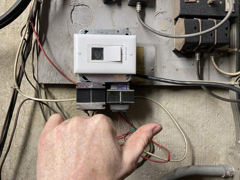 Reconfigured door access control system in outer vestibule by resetting the locking schedule as requested. Troubleshooted and reprogrammed the controller labeled "FRONT DOOR" that was not functioning properly at location 1077. Successfully restored automatic nightly locking functionality to all entrance doors.