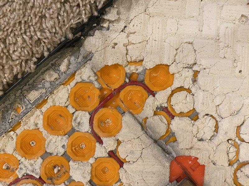 Responded to service call regarding suspected damaged in-floor heating wire. Inspection revealed deteriorated floor surface with cracked concrete and exposed heating elements. Performed electrical testing at junction box to identify and isolate the damaged circuit. Successfully located and repaired the compromised heating wire that had been inadvertently damaged during previous work.