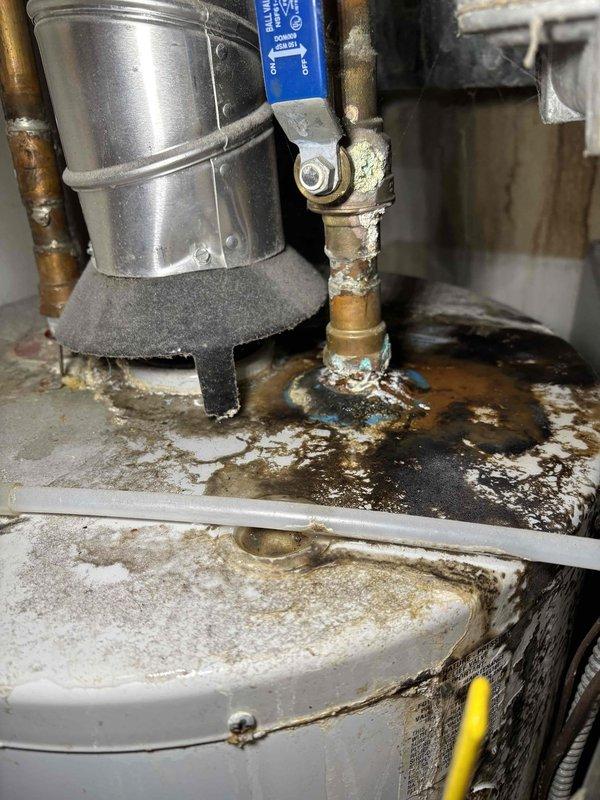 Completed scheduled Fall maintenance on customer's furnace. Observed significant corrosion and water damage on water heater components, including oxidized brass pipes, mineral buildup at connection points, and evidence of long-term moisture exposure. Documented extensive rust on nearby metal panels and recommended addressing water damage issues to prevent further deterioration.