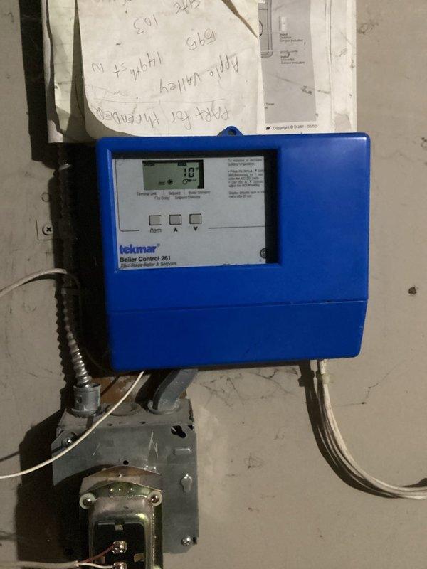 Performed safety inspection on two boilers in basement per Minneapolis Rental HVAC safety check requirements. Inspected Tekmar Boiler Control 261 unit and verified pressure/temperature gauge readings were within normal operating parameters. No issues identified during maintenance inspection.