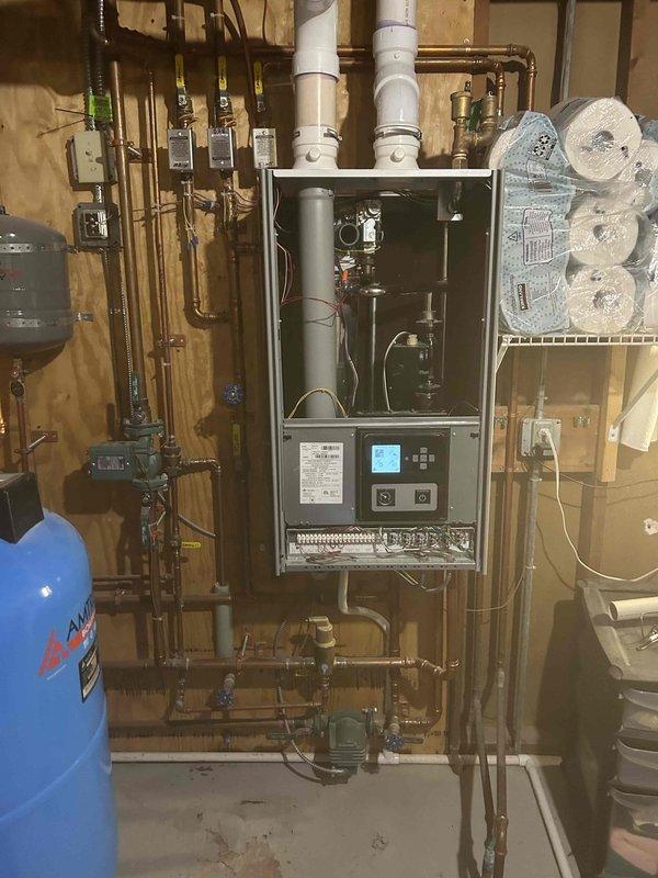 Responded to after-hours service call for non-functioning boiler following recent tune-up. Diagnosed ignition failure in one of the units, preventing proper flame establishment. Restored ignition system functionality and verified proper operation of all boiler components, returning the heating system to normal operation.
