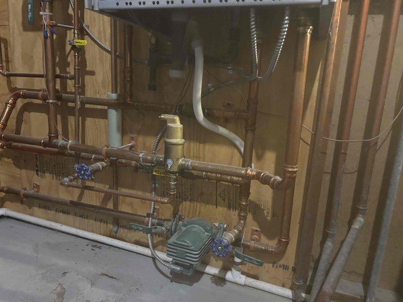 Responded to after-hours service call for non-functioning boiler following recent tune-up. Diagnosed ignition failure in one of the units, preventing proper flame establishment. Restored ignition system functionality and verified proper operation of all boiler components, returning the heating system to normal operation.