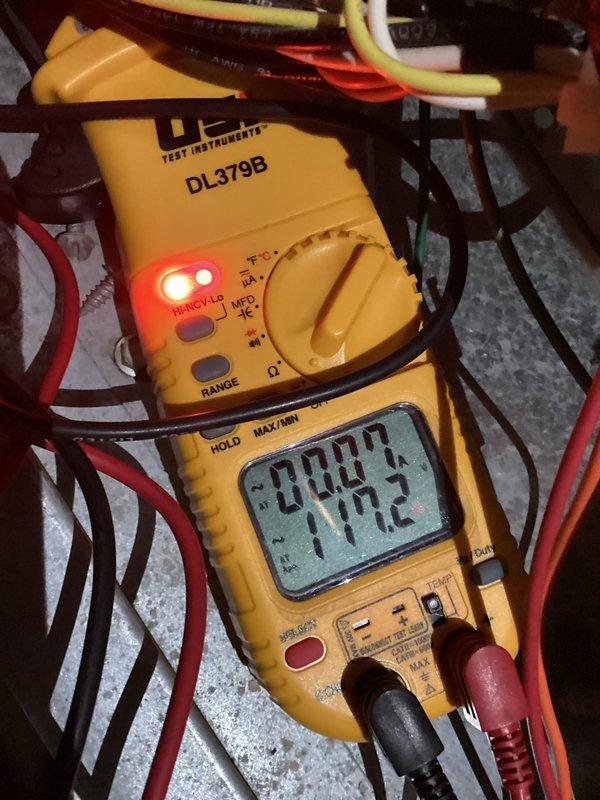 Responded to after-hours no-heat emergency where furnace was initially making loud noises before switching to cold air output. Diagnostic testing with multimeter revealed faulty inducer motor. Replaced inducer motor assembly to restore proper heating function.