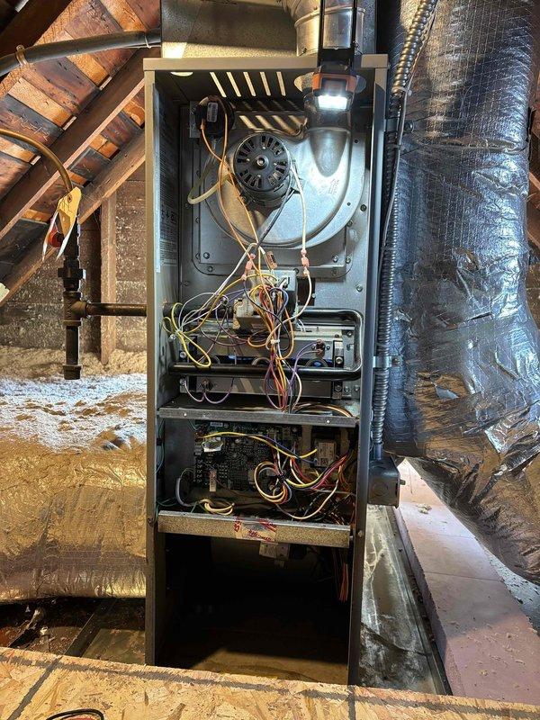 Completed fall tune-up maintenance service on standard furnace system located in attic. Performed comprehensive inspection of internal components including blower motor, fan assembly, circuit boards, and electrical connections. All systems functioning properly with no issues identified.