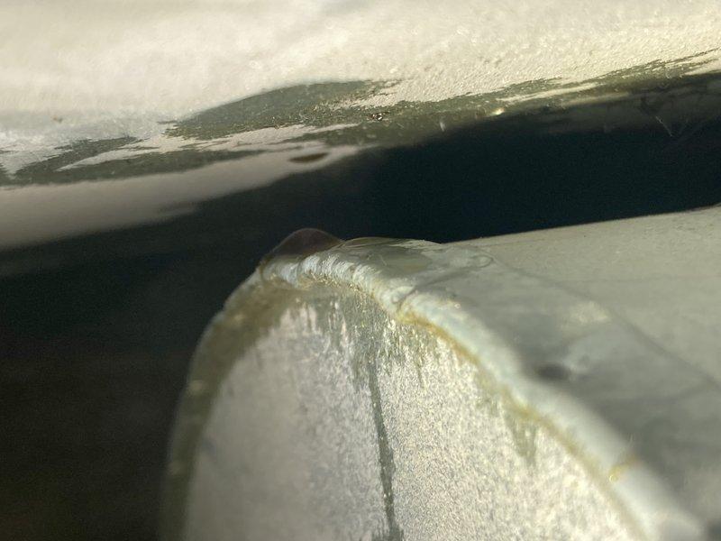 Responded to service call for furnace failing to maintain set temperature. Diagnostic inspection revealed inducer motor with burnt plastic odor and blower motor showing oil residue. Presented customer with options for component replacement versus full system replacement; customer will consider both alternatives before proceeding.