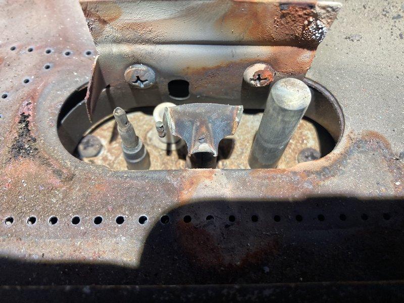 Responded to service call for non-functioning gas fireplace. Diagnosed failed gas valve preventing ignition. Observed significant corrosion and rust on valve assembly and surrounding components. Recommended complete valve replacement to restore proper operation.