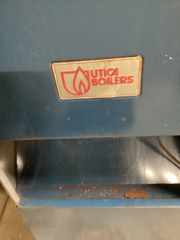Performed scheduled heating maintenance on Utica Boilers unit. Identified faulty pressure gauge providing incorrect readings and replaced it. System now operating within normal parameters.