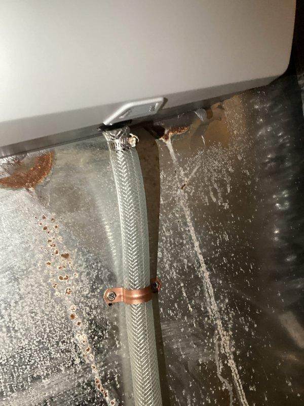 Responded to service call for leaking humidifier that customer had previously shut off. Inspection revealed water panel casing was slightly offset from proper position. Repositioned casing to ensure proper alignment with drain, resolving the leak issue.