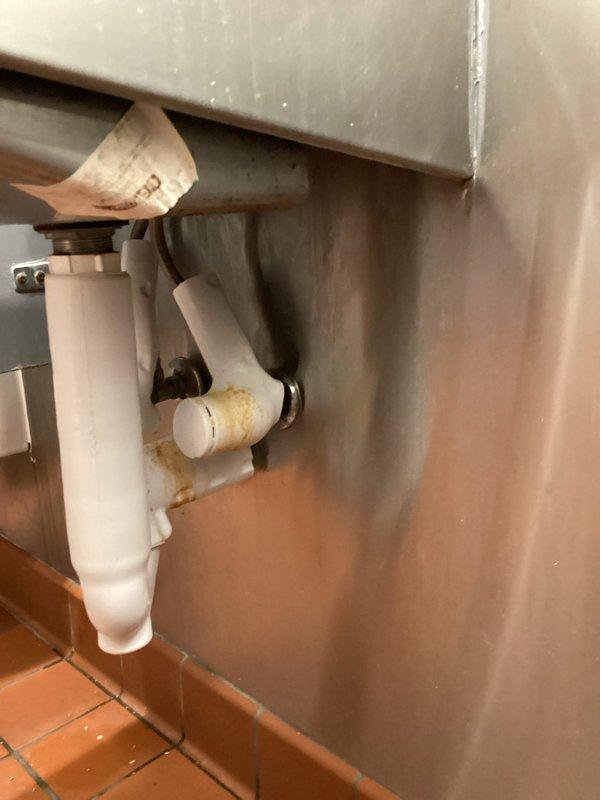 Responded to service request regarding broken men's bathroom faucets. Inspected existing commercial-grade lavatory fixtures and plumbing connections, noting mineral buildup at pipe joints. Prepared estimate for replacement of two commercial faucets with matching units and verified proper water flow in sink basins.