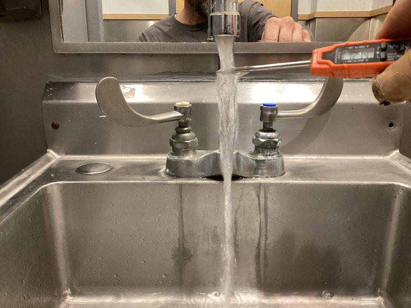 Responded to service request regarding broken men's bathroom faucets. Inspected existing commercial-grade lavatory fixtures and plumbing connections, noting mineral buildup at pipe joints. Prepared estimate for replacement of two commercial faucets with matching units and verified proper water flow in sink basins.