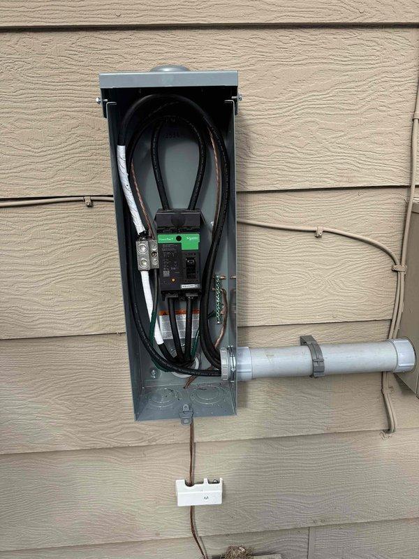Successfully completed a 150 amp electrical panel upgrade, replacing the existing 100 amp Square D HOM panel with a new 150 amp Eaton BR panel featuring new breakers throughout. Installed a new meter socket with bypass and main disconnect, added a 2" PVC expansion coupling to the down pipe per code requirements, and installed a whole house surge protector. Also set up Dakota Electric's multi-load off-peak system with CT cabinet, sub-meter with LCR, and EV charger installation.