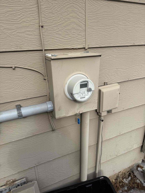 Successfully completed a 150 amp electrical panel upgrade, replacing the existing 100 amp Square D HOM panel with a new 150 amp Eaton BR panel featuring new breakers throughout. Installed a new meter socket with bypass and main disconnect, added a 2" PVC expansion coupling to the down pipe per code requirements, and installed a whole house surge protector. Also set up Dakota Electric's multi-load off-peak system with CT cabinet, sub-meter with LCR, and EV charger installation.
