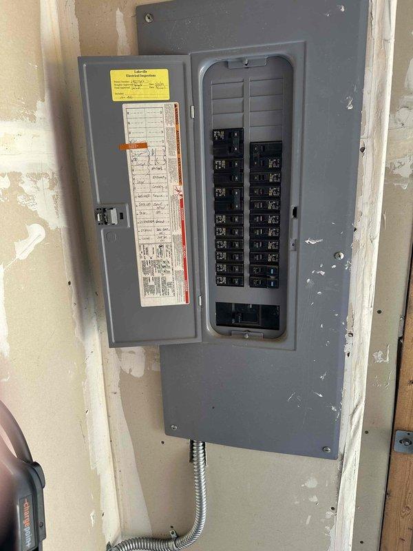 Completed installation of Xcel-supplied EV charger adjacent to the existing electrical panel using surface-mounted conduit for protection. Hardwired and fused the charging station at 60 amps to provide 48 amp output capacity, and successfully configured the ChargePoint app connectivity during installation.