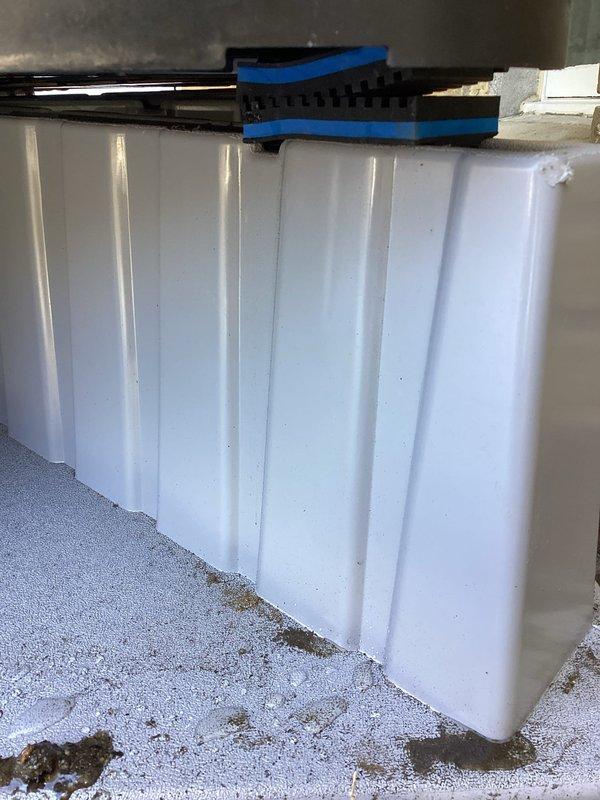 Responded to service call for recently installed heat pump that had become unlevel and was producing increased operational noise. Inspection revealed shifting of support pads causing unit misalignment. Removed unit, properly repositioned support pads, and reinstalled heat pump to restore correct level positioning, which resolved the noise issue.