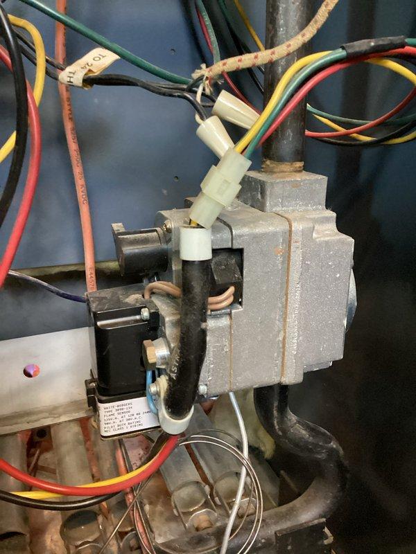 Diagnosed intermittent no-heat condition on residential boiler with pilot light ignition failure. Inspected White-Rodgers 3098-134 flame sensor and associated wiring, finding oxidation on sensor and copper components. Cleaned flame sensor, restored proper ignition sequence, and verified system operation through multiple heating cycles.