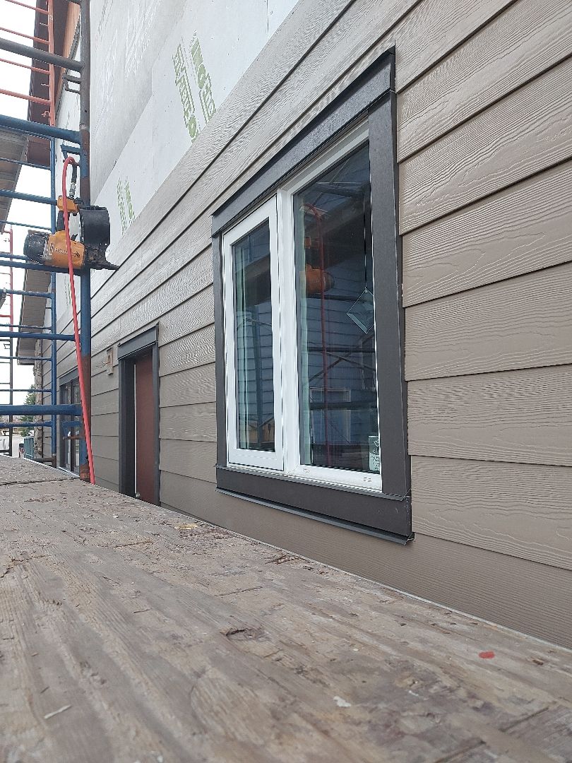 Calgary, AB - An in process shot of the Woodstock Brown Hardie Plank and the Rich Espresso Hardie Trim in SE Calgary Calgary, AB - An in process shot of the Woodstock Brown Hardie Plank and the Rich Espresso Hardie Trim in SE Calgary