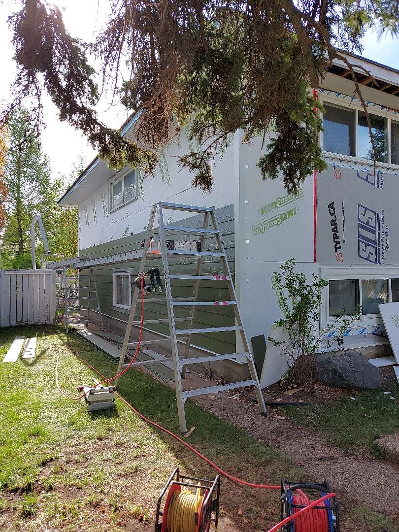 Calgary, AB - SW Calgary in process......Mountain Sage Hardie Lap siding with accent Arctic White NT3 smooth Hardie Trim corner Calgary, AB - SW Calgary in process......Mountain Sage Hardie Lap siding with accent Arctic White NT3 smooth Hardie Trim corner