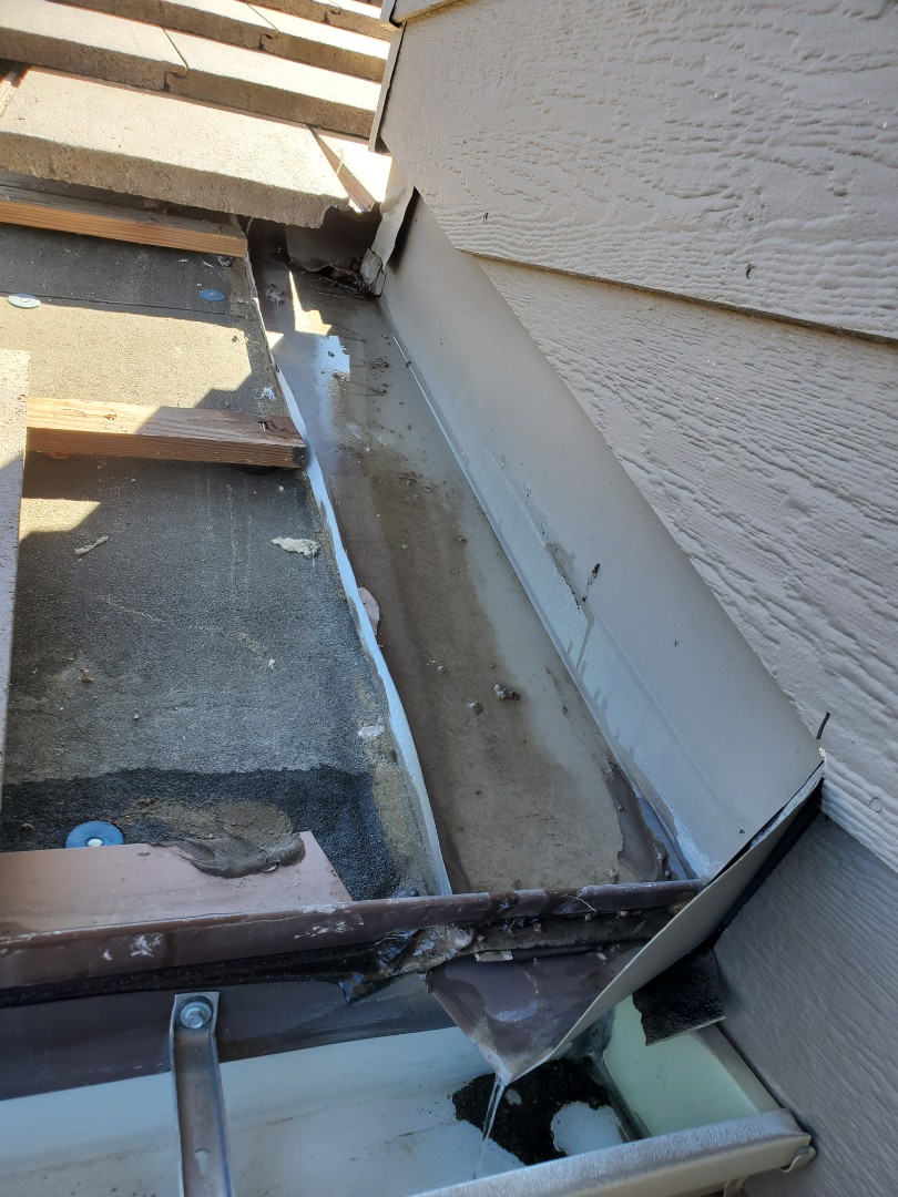 Littleton, CO - We are inspecting a roof leak on this tile roof in Highlands Ranch where water has gotten into the house and done a lot of drywall damage. We identified the problem with the flashing and are proposing replacing the flashing and diverting the water from a downspout further from the house Littleton, CO - We are inspecting a roof leak on this tile roof in Highlands Ranch where water has gotten into the house and done a lot of drywall damage. We identified the problem with the flashing and are proposing replacing the flashing and diverting the water from a downspout further from the house
