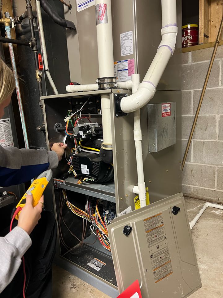 Performing fall furnace maintenance on Bryant system in St. Boni, MN