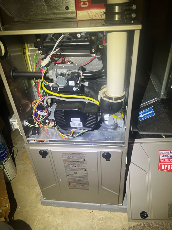 Performing winter furnace maintenance on a Bryant system in St. Louis Park, Minnesota