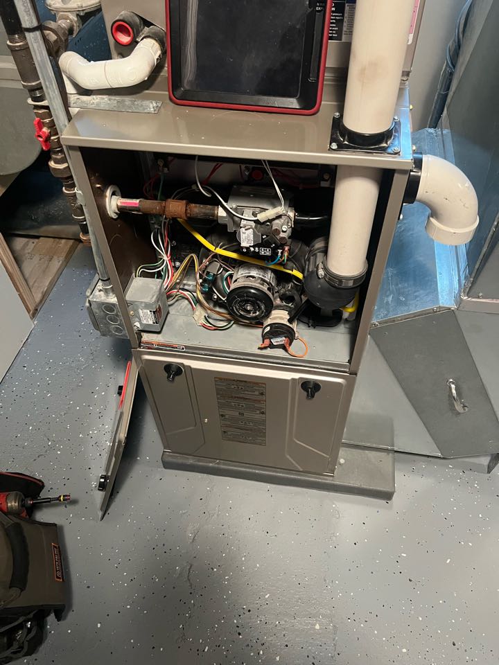 Performing winter furnace maintenance on Bryant system in St. Louis Park, Minnesota