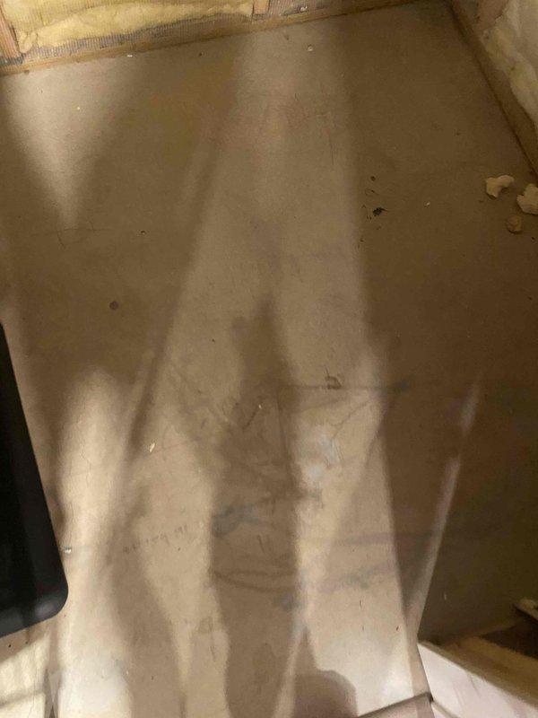 Relocated plumbing vent piping in attic space using 2" PVC materials. Installed new 2" vent kit with proper coupling connections and routing through existing framing to accommodate layout requirements. Protected work area with floor covering during installation and ensured proper integration with existing plumbing system.