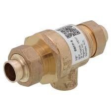 Replaced defective backflow preventer and pressure reducing valve on hydronic heating system. Removed existing brass valve assembly and installed new pressure reducing valve with integral backflow prevention. System tested and verified proper operation with no leaks detected at connections.