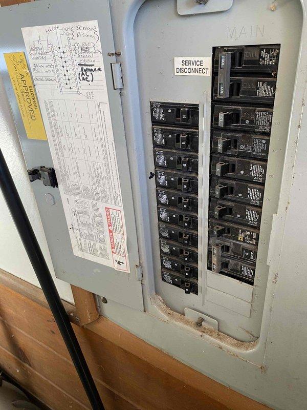 Completed installation of 4-head mini-split system with ground-mounted condenser positioned at minimum allowable height for cooling-only operation. Ran 150 feet of line set up exterior wall and through attic space to distribute refrigerant lines to all four indoor head units, with one head located on same side as outdoor unit. Verified electrical connections at service panel and ensured all circuit breakers were properly sized and functioning for system operation.