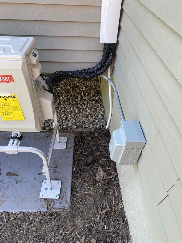 Completed installation of single-head mini-split ductless system with 20-foot line set following HOA approval of outdoor unit placement. Mounted condensing unit on concrete pad with proper electrical disconnect, installed wall-mounted indoor air handler, and ran refrigerant lines and electrical connections between units. System tested and operational upon completion.