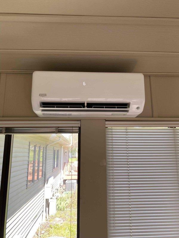 Completed installation of single-head mini-split ductless system with 20-foot line set following HOA approval of outdoor unit placement. Mounted condensing unit on concrete pad with proper electrical disconnect, installed wall-mounted indoor air handler, and ran refrigerant lines and electrical connections between units. System tested and operational upon completion.