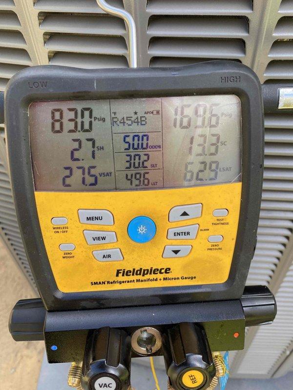 Performed diagnostic evaluation on HVAC system and identified refrigerant undercharge condition. Measured system pressures using refrigerant manifold gauge, recording 830 psig high-side and 16.96 psig low-side pressures with superheat at 2.1°F and subcooling at 13.3°F. Documented ambient conditions at 60.4°F and 13.8% relative humidity. Due to low outdoor temperatures (40-45°F), accurate refrigerant charge verification cannot be completed at this time, as temperature fluctuations affect pressure readings and system performance assessment. Return visit scheduled when ambient temperature reaches 70°F or above to properly test and adjust refrigerant charge to manufacturer specifications.