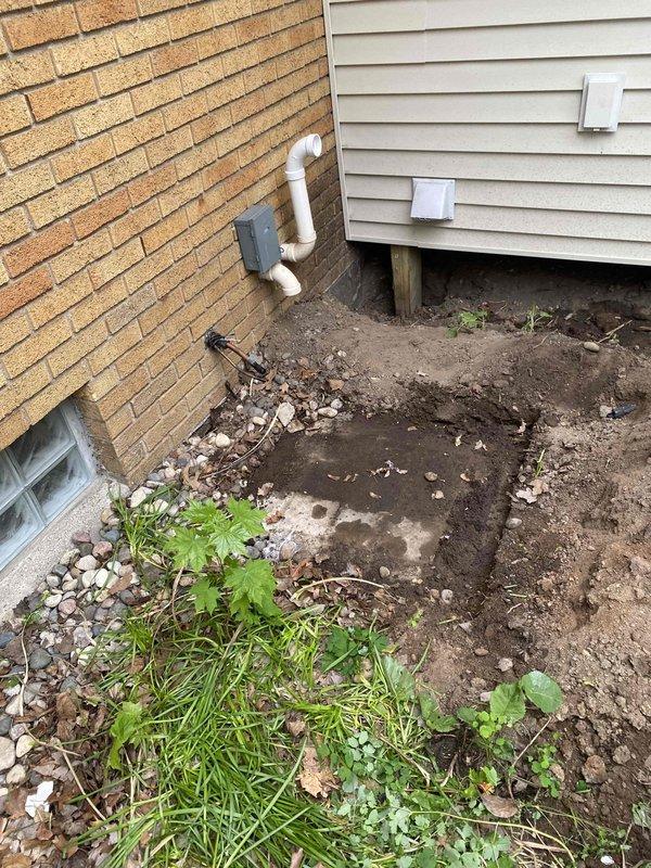 Relocated outdoor air conditioning condenser unit to accommodate construction work at the property. Disconnected refrigerant lines and electrical connections, moved unit from original exterior location to temporary storage area in garage, and secured all components for safe storage during construction period.