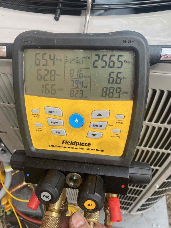Arrived on site to replace outdoor unit under warranty but discovered a 6/4 transformer failure in the neighborhood had caused a power outage. Unable to complete the installation without power to the area. Documented current system conditions using refrigerant manifold and micron gauge, capturing pressure and temperature readings for reference upon return. Job rescheduled pending power restoration by utility company.