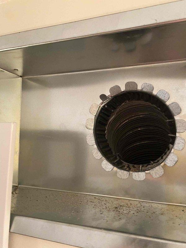 Responded to warranty callback for install less than one year old regarding concerns about existing chimney liner causing headaches. Removed original chimney liner that was reused during initial installation and replaced with new 5x35 liner from shop inventory. Installed new flexible liner through existing ductwork penetration, secured metal collar assembly at wall termination point, and verified proper connection to HVAC system.