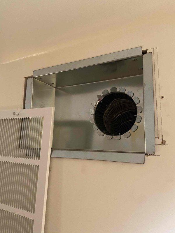 Responded to warranty callback for install less than one year old regarding concerns about existing chimney liner causing headaches. Removed original chimney liner that was reused during initial installation and replaced with new 5x35 liner from shop inventory. Installed new flexible liner through existing ductwork penetration, secured metal collar assembly at wall termination point, and verified proper connection to HVAC system.