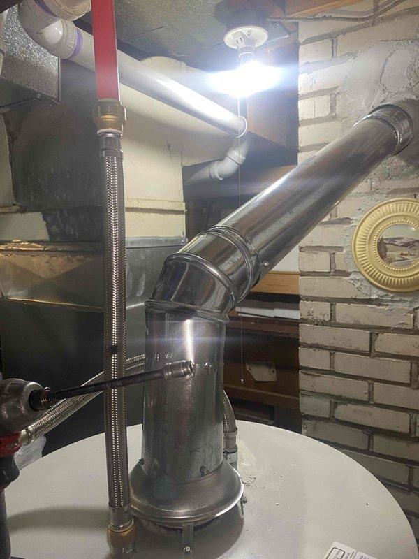 Completed inspection corrections following failed final mechanical inspection for water heater and chimney liner replacement. Relocated water supply line to provide independent support separate from ductwork per code requirements. Relocated gas supply line to provide independent support separate from ductwork per code requirements. Adjusted Class C venting routing to maintain minimum 6" clearance from PEX water line and other combustible materials throughout the installation. All corrections addressed inspector's noted deficiencies and installation brought into compliance with mechanical code standards for re-inspection approval.