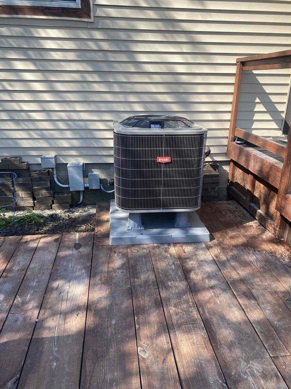 Completed full system installation of Bryant heat pump system in mobile home. Installed outdoor condenser unit on elevated metal platform with proper clearances on existing wooden deck, including electrical conduit and refrigerant line connections. Installed indoor furnace air handler in utility closet with PVC venting system, completed all electrical wiring and control connections, and verified proper system operation and airflow.