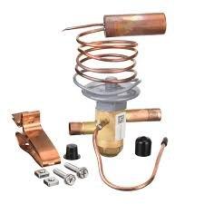 Responded to service call for air conditioning system repair. Diagnosed faulty thermal expansion valve (TXV) and returned to shop to collect replacement component. Replaced defective TXV with new unit, including sensing bulb, capillary tube, valve body, and mounting hardware to restore proper refrigerant metering and system operation.