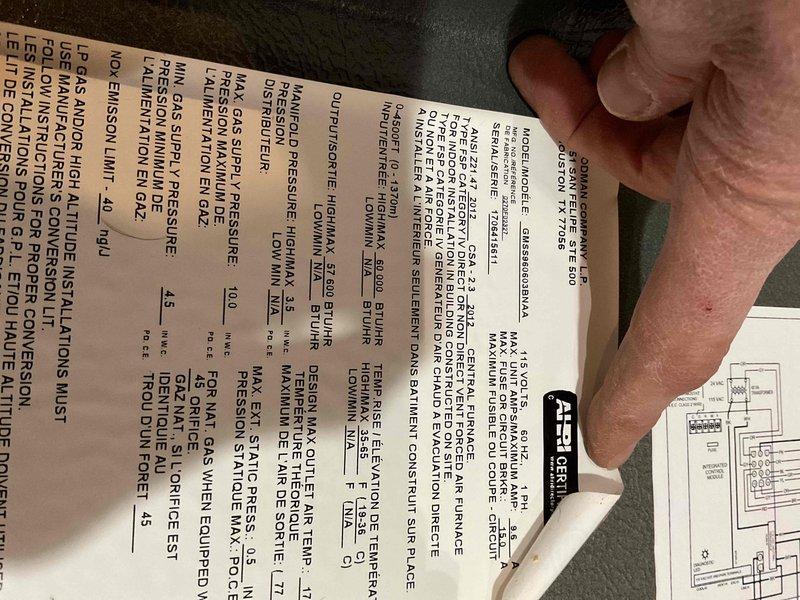 Replaced defective saddle valve on humidifier supply line. Drained domestic water system to facilitate safe removal and installation of new brass saddle valve assembly with compression fittings. Restored water supply and verified proper operation with no leaks detected at connection points.