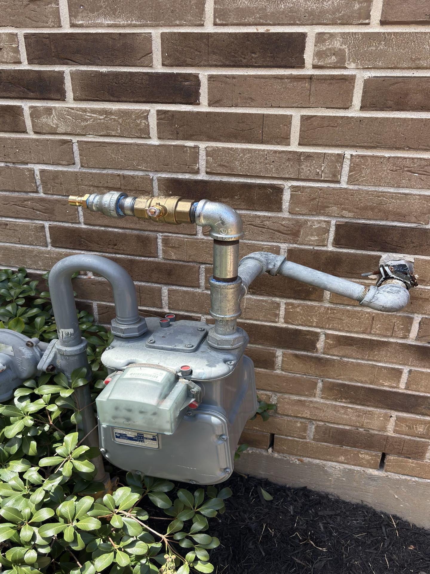 Katy, TX - Added shut off valve at the gas meter for homeowner to quick connect their natural gas portable generator. 