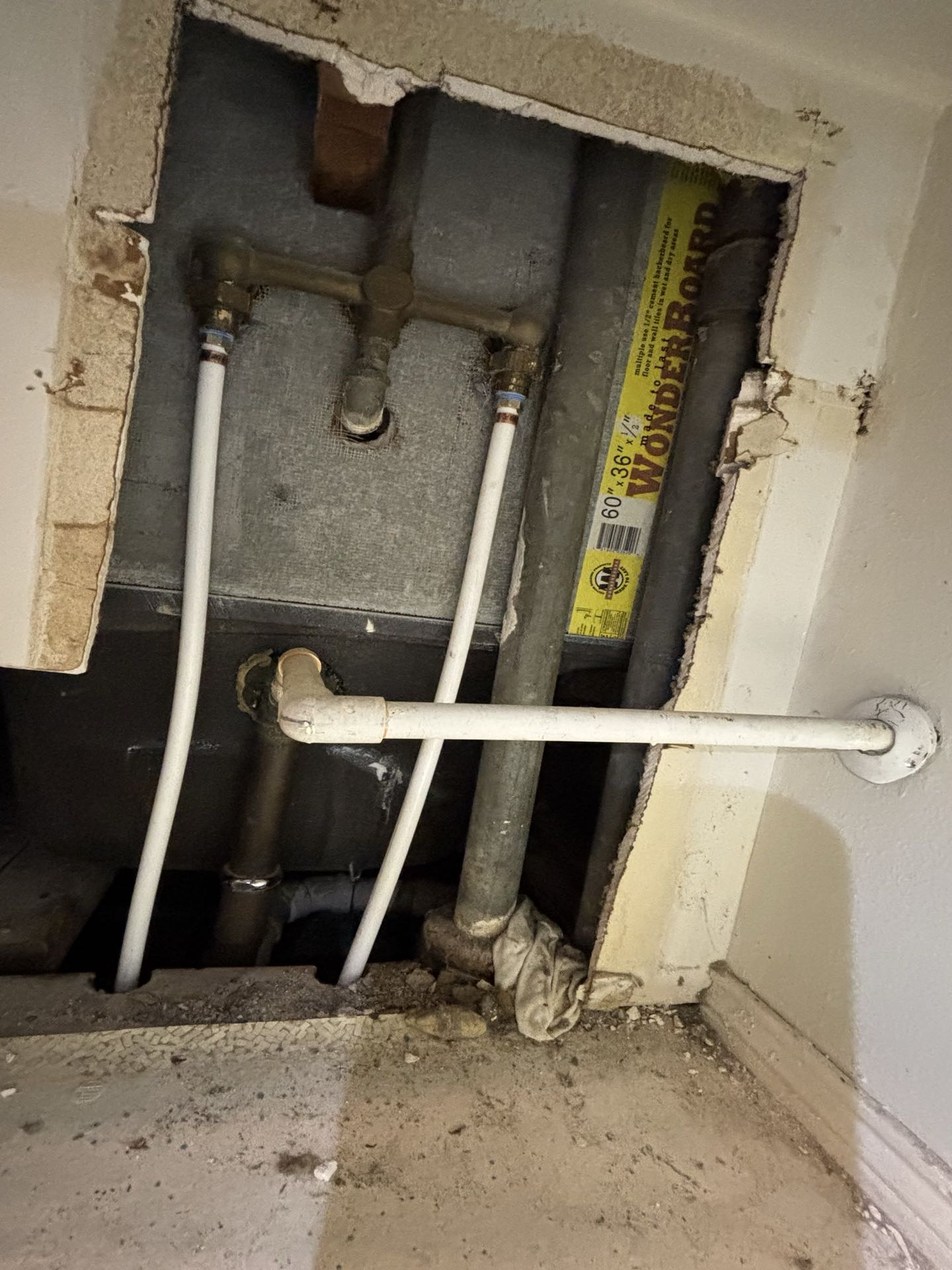 Houston, TX - Galvanized pipe replacement and leak repair in the wall behind the tub and shower. We replaced the bad galvanized pipes with pex piping and caused no extra damage. 